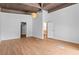 Spacious main bedroom with wood floors, peaked, wood-paneled ceiling and closet access at 18816 Carr Dr, Lutz, FL 33559