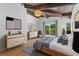 Main bedroom features a wood ceiling, balcony access and warm tones at 18816 Carr Dr, Lutz, FL 33559