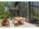 Outdoor patio features string lights, dining table, and large windows at 18816 Carr Dr, Lutz, FL 33559