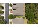 Aerial view showcasing the condo building layout, landscaping, and parking at 2131 River Turia Cir, Riverview, FL 33578