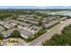 This aerial view displays the condo community and surrounding area, set next to a main road for easy access at 2131 River Turia Cir, Riverview, FL 33578