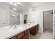 Bathroom featuring a double sink vanity, a mirror, and a glass shower enclosure at 2131 River Turia Cir, Riverview, FL 33578