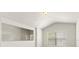 Bright bedroom featuring a vaulted ceiling and large windows at 2131 River Turia Cir, Riverview, FL 33578