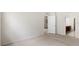 Spacious bedroom featuring plush carpeting and ensuite access to the bathroom at 2131 River Turia Cir, Riverview, FL 33578