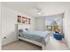 Bright bedroom featuring a bed, ceiling fan, and a window with natural light at 2131 River Turia Cir, Riverview, FL 33578