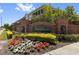 Sign for Villa Serena community entrance with brick wall and flower bed at 2131 River Turia Cir, Riverview, FL 33578