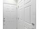 A clean and bright hallway with multiple white doors at 2131 River Turia Cir, Riverview, FL 33578