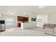 Bright, open living area with an adjacent kitchen and comfortable seating, perfect for entertaining at 2131 River Turia Cir, Riverview, FL 33578