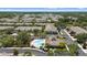 A stunning view displays a community pool with a brick surround, situated in a well-manicured condo community at 2131 River Turia Cir, Riverview, FL 33578