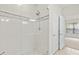 The luxurious shower is tiled, framed in glass, and features a modern shower head at 2131 River Turia Cir, Riverview, FL 33578