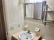 Bathroom featuring a sink, mirror and patterned wallpaper at 2287 Philippine Dr # 29, Clearwater, FL 33763