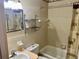 Cozy bathroom with a shower/tub combination and a curved shelving unit at 2287 Philippine Dr # 29, Clearwater, FL 33763