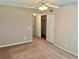Spacious bedroom with a ceiling fan and sliding door closet at 2287 Philippine Dr # 29, Clearwater, FL 33763