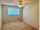 Bedroom with large window and ceiling fan at 2287 Philippine Dr # 29, Clearwater, FL 33763