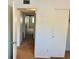 Hallway featuring multiple closets and entryways with neutral tones at 2287 Philippine Dr # 29, Clearwater, FL 33763