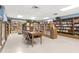 Well-lit library with rows of bookshelves, cozy seating, and a table for studying or reading at 2287 Philippine Dr # 29, Clearwater, FL 33763