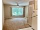 Inviting living room features neutral tones, large window and ceiling fan at 2287 Philippine Dr # 29, Clearwater, FL 33763