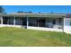 Enclosed back porch offers a relaxing outdoor living space at 2310 Medford Ln, Brandon, FL 33511