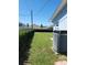 A/C unit in a grassy backyard at 2310 Medford Ln, Brandon, FL 33511