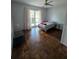 Bedroom features hardwood floors and natural light at 2310 Medford Ln, Brandon, FL 33511