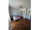 Bedroom with hardwood floors, shelving, and closet at 2310 Medford Ln, Brandon, FL 33511