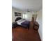 Cozy bedroom with hardwood floors, neutral colors, and a comfortable bed at 2310 Medford Ln, Brandon, FL 33511