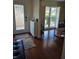 Inviting entryway with a decorative front door, tile flooring, and ample natural light from a sidelight window at 2310 Medford Ln, Brandon, FL 33511