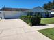 Classic home featuring a spacious driveway and neatly trimmed greenery at 2310 Medford Ln, Brandon, FL 33511