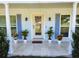Inviting front porch with decorative plants and tiled flooring at 2310 Medford Ln, Brandon, FL 33511