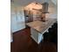 Modern kitchen featuring stainless steel appliances, a marble countertop island, and sleek cabinetry at 2310 Medford Ln, Brandon, FL 33511