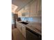 Modern kitchen featuring custom cabinets, stone countertops, and stainless steel appliances, perfect for culinary enthusiasts at 2310 Medford Ln, Brandon, FL 33511