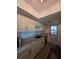 Well-lit kitchen featuring custom cabinets, granite countertops, stainless steel dishwasher and an exterior door at 2310 Medford Ln, Brandon, FL 33511