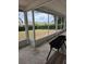 Lanai with tiled floors and screened in exterior at 2310 Medford Ln, Brandon, FL 33511
