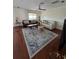 Spacious living room with hardwood floors, a patterned rug, and comfortable seating at 2310 Medford Ln, Brandon, FL 33511