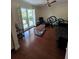Comfortable living room with natural light and hardwood floors, ideal for relaxation and entertaining guests at 2310 Medford Ln, Brandon, FL 33511