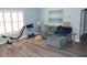 Inviting living room with comfortable seating, soft lighting, and a workout station, perfect for relaxation and exercise at 2513 Newbern Ave, Clearwater, FL 33761