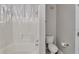 Bathroom with shower and tub combination and a white toilet at 2717 Via Cipriani # 631B, Clearwater, FL 33764