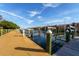Beautiful marina view from the dock, showcasing waterfront properties and boat slips under a sunny sky at 2717 Via Cipriani # 631B, Clearwater, FL 33764