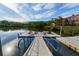 Dock with kayaks available, set against a backdrop of lush greenery and upscale residential buildings at 2717 Via Cipriani # 631B, Clearwater, FL 33764