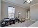 Office with a window, a ceiling fan, a desk and chair, and a lamp at 2717 Via Cipriani # 631B, Clearwater, FL 33764