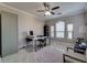 Office with a ceiling fan, desk and chair, a bookshelf, and three windows with blinds at 2717 Via Cipriani # 631B, Clearwater, FL 33764