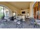 Inviting outdoor patio with comfortable seating and a bar area, perfect for entertaining guests at 2717 Via Cipriani # 631B, Clearwater, FL 33764