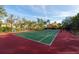 Well-maintained tennis court surrounded by lush landscaping, perfect for active recreation at 2717 Via Cipriani # 631B, Clearwater, FL 33764