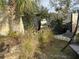 Stone pathway with grass accents, leading to a backyard area at 307 Orangewood Ln, Largo, FL 33770
