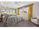 Bedroom with neutral colored walls, a ceiling fan, and large bed at 307 Orangewood Ln, Largo, FL 33770