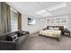 Cozy bedroom area boasts a large window, comfortable sitting area and soft carpeting at 307 Orangewood Ln, Largo, FL 33770
