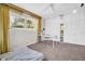 Bedroom featuring a desk and ample closet space with mirrored door at 307 Orangewood Ln, Largo, FL 33770