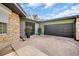A spacious driveway leads to an attached garage, complemented by decorative plants, enhancing the home's curb appeal at 307 Orangewood Ln, Largo, FL 33770