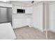 Bright kitchen featuring stainless steel appliances, white cabinets, and wood-look flooring at 307 Orangewood Ln, Largo, FL 33770