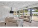 Living room overlooking backyard with sliding doors, and view of the pool at 307 Orangewood Ln, Largo, FL 33770